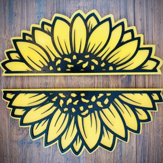 Interchangeable EverWreath sunflower plate set with layered yellow sunflower petals on a wood background