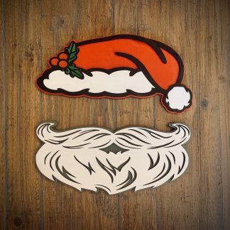 Interchangeable EverWreath Christmas plate set with a red Santa hat and white Santa beard pieces on a wood background