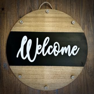 Round wooden EverWreath base welcome sign with natural wood finish, black center band, and white “Welcome” lettering