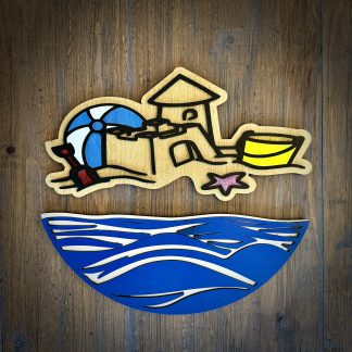 Interchangeable EverWreath beach-themed plate set with a sand castle, beach umbrella, bucket, starfish, and blue wave base pieces