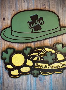 Interchangeable EverWreath St. Patrick’s Day plate set with a green lucky hat, shamrocks, gold coins, and a “Happy St. Patrick’s Day” banner on a wood background