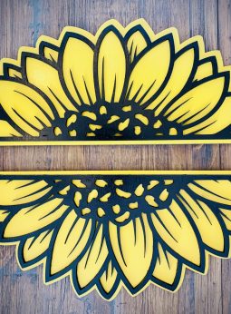 Interchangeable EverWreath sunflower plate set with layered yellow sunflower petals on a wood background